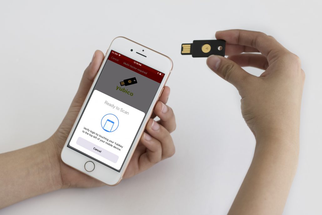 A person is using a password manager YubiKey